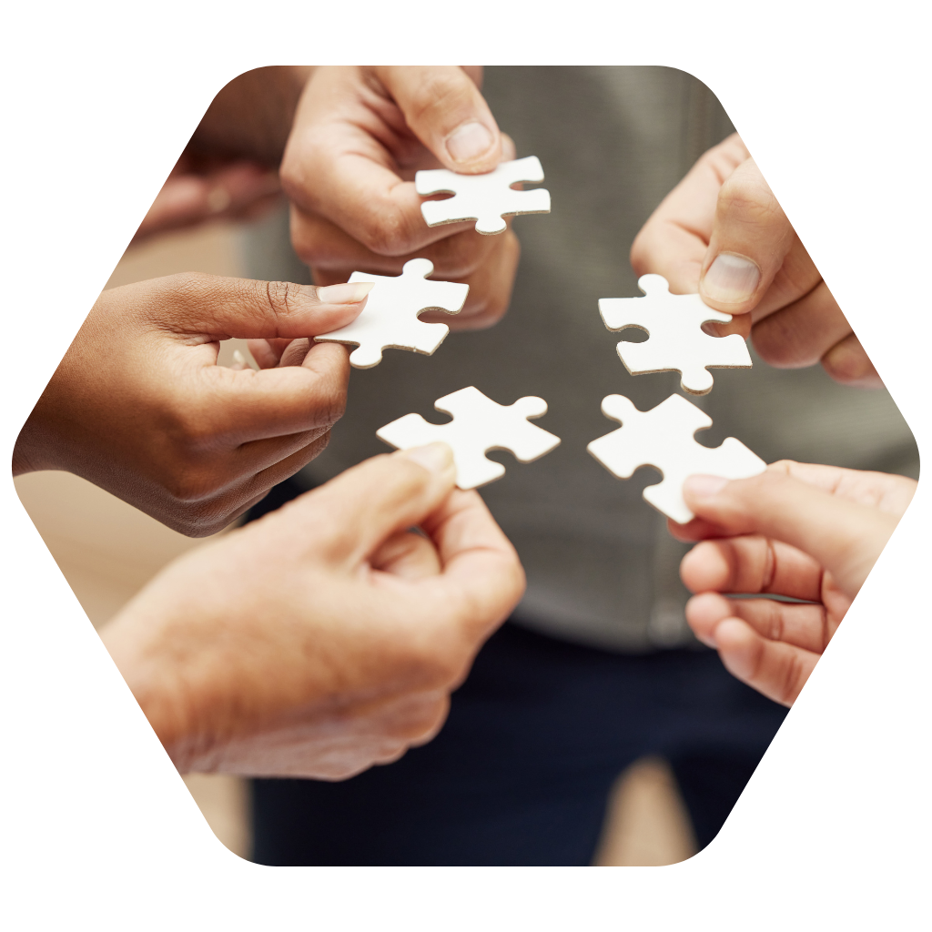 team connection fit compatibility togetherness hands holding a piece of interconnecting puzzle